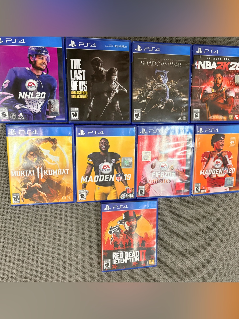 Sony PS4 Game Lot with Blue Cases and Colorful Covers